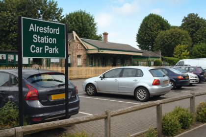 Alresford station car park with parked cars